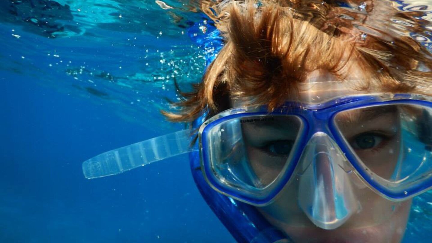 Boy doing snorkeling. Scuba diving and snorkeling in Aqaba